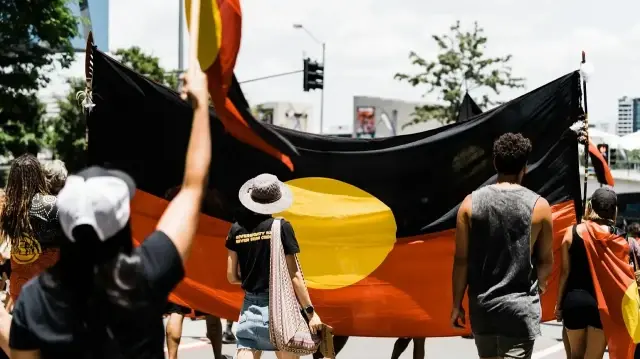 Indigenous communities participating in a march related to Victoria signing Australia’s first Indigenous treaty